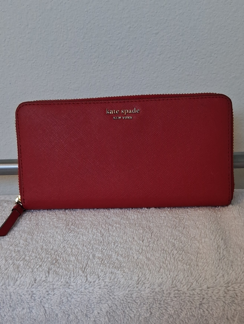 kate spade red zip-around continental wallet with gold logo